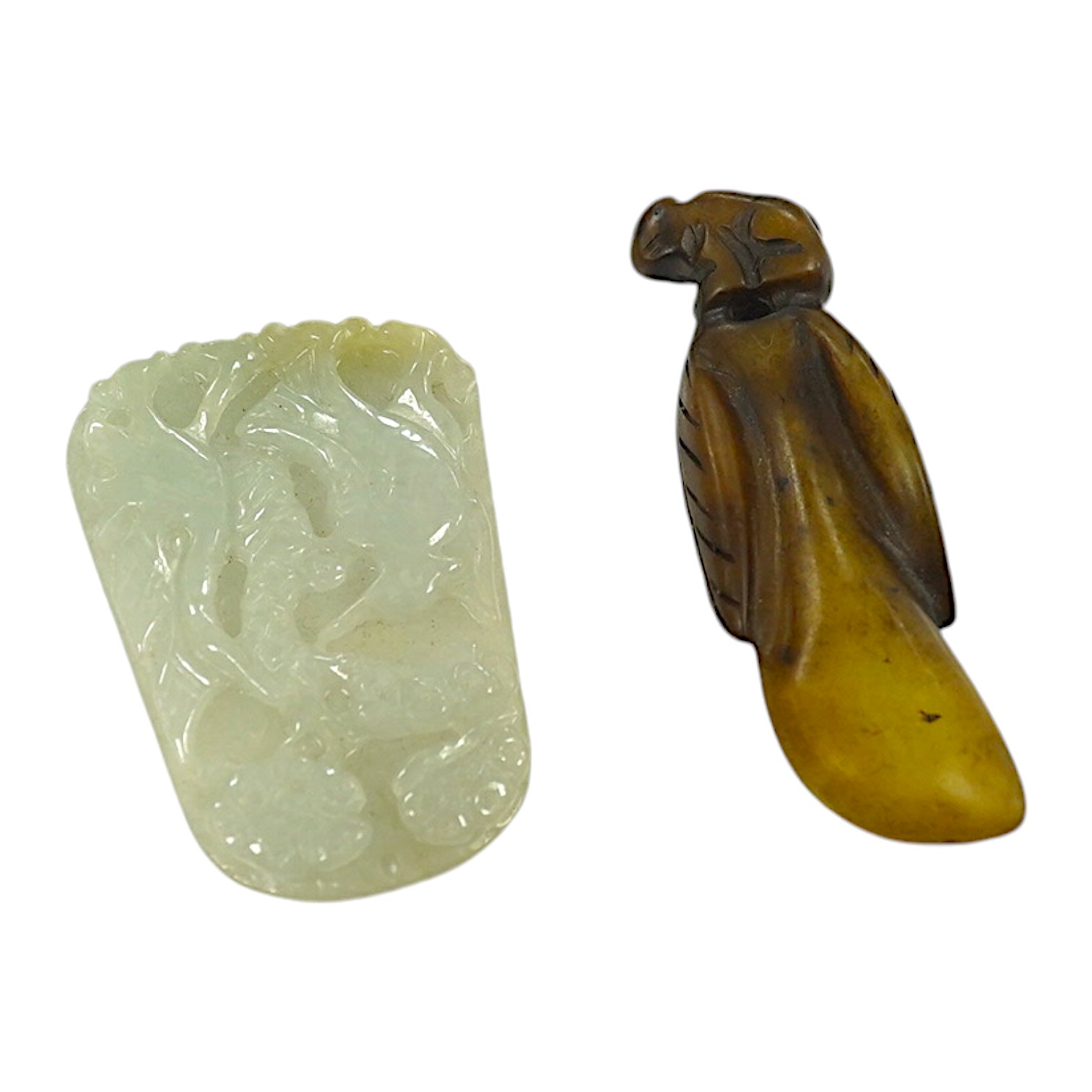 A Chinese jadeite pendant and a carving of a bud, largest 6cm high (2). Condition - good